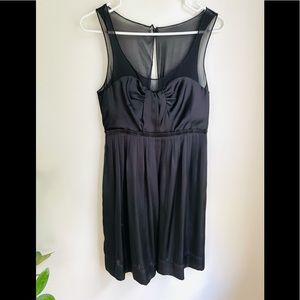American Eagle size 6 black satin and sheer details with button back